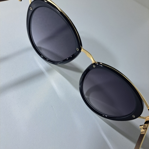 Prada Black Frame Sunglasses with Gold Temple Accents - Picture 5 of 12